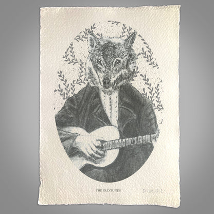 A graphite drawing on textured paper shows a wolf with a human body in a suit playing guitar, framed by leafy branches. This unique wall art echoes vintage elegance. Text below reads The Old Tunes.